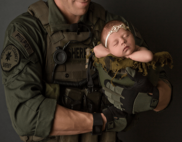 holding daughter in kevlar