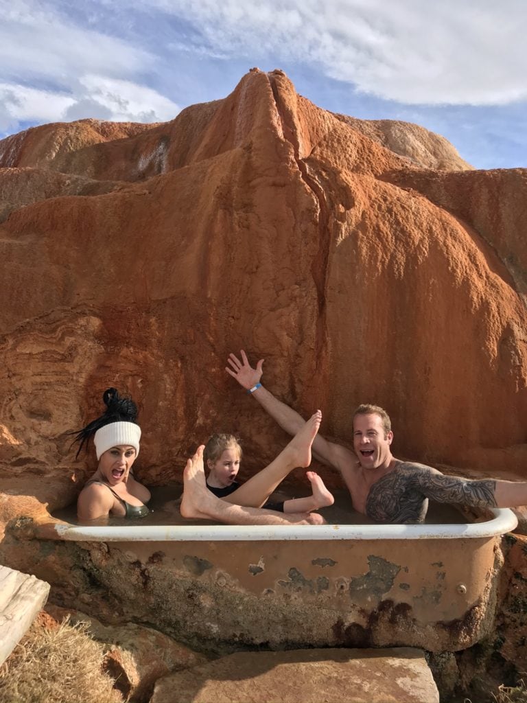 family in hot spring bathtub